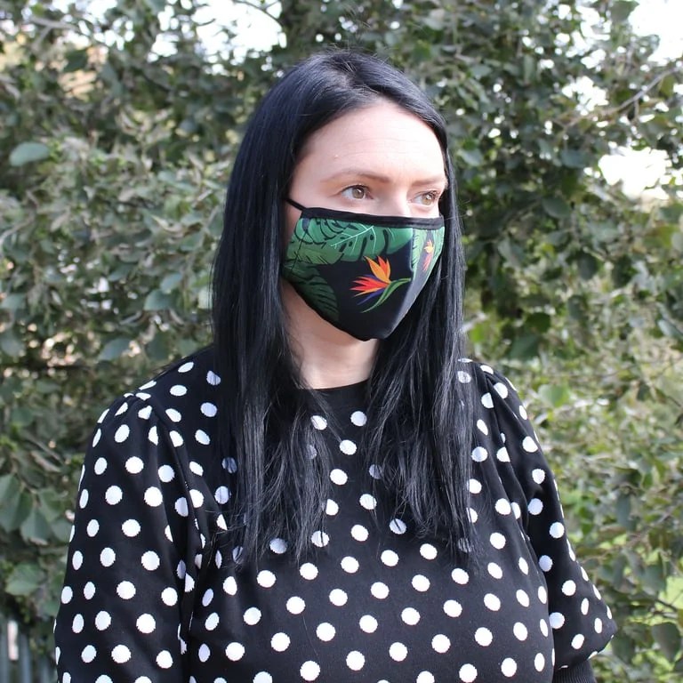 Reusable fashion face covering with green jungle pattern in a stylish adult style.