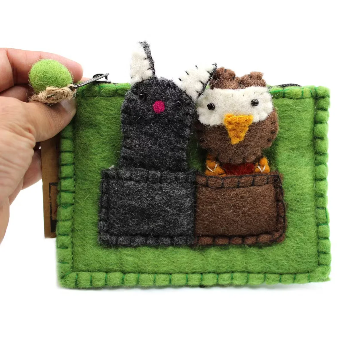 Pouch featuring owl and pussycat toys in the form of finger puppets