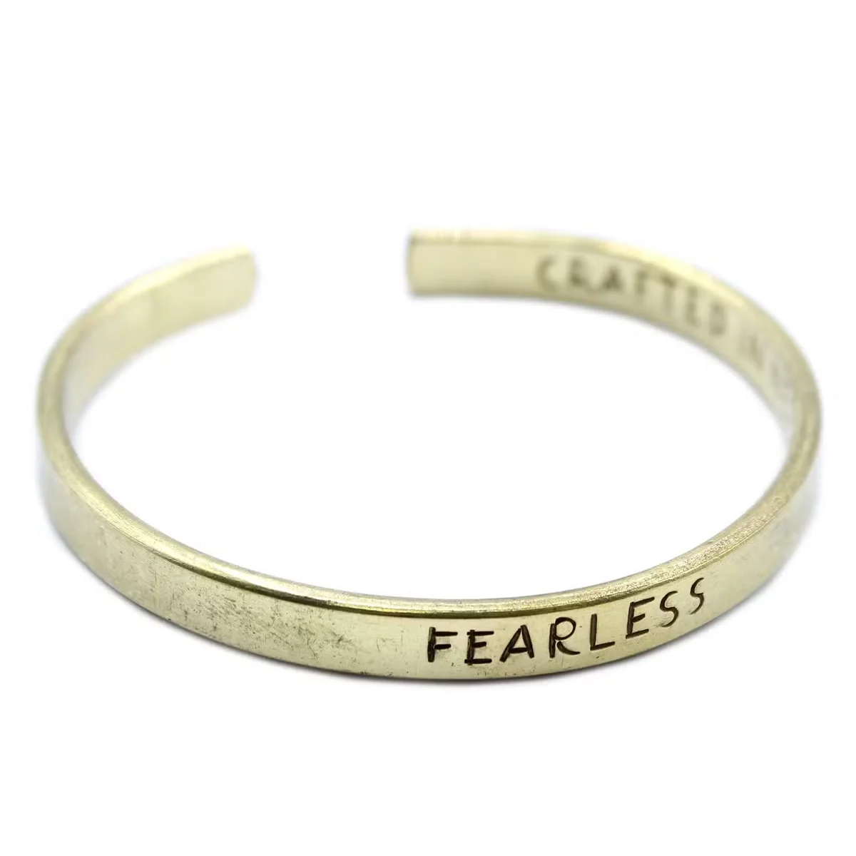 Bracelet in shining brass with elegant design, showcasing stylish brass jewellery