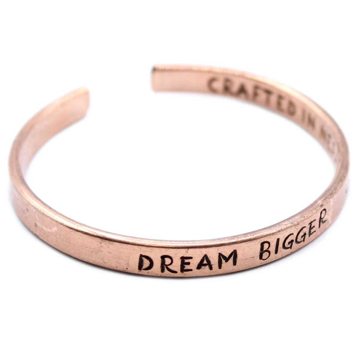 Copper Inspiration Bracelet displayed as elegant copper jewellery, curling gracefully on a wrist.