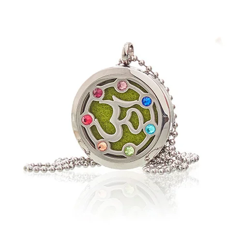 Close-up of 30mm OM Chakra aromatherapy pendant necklace with intricate design on silver chain