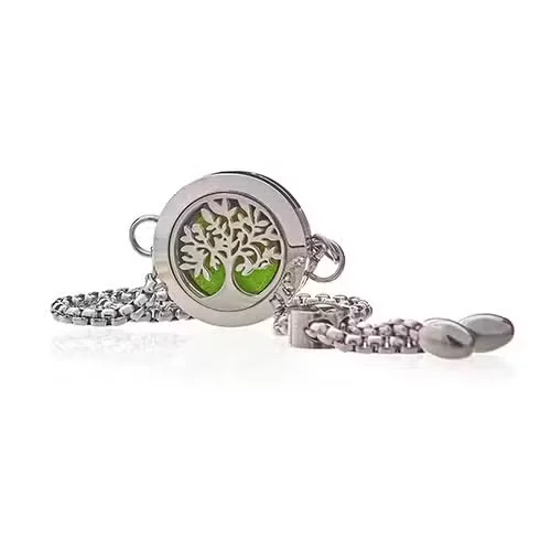 Close-up of 20mm Tree of Life aromatherapy jewellery UK chain bracelet with detailed metal links and pendant