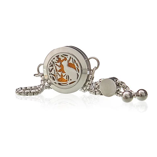 Close-up of aromatherapy flower charm bracelet with cat and flower designs on a 20mm chain bracelet