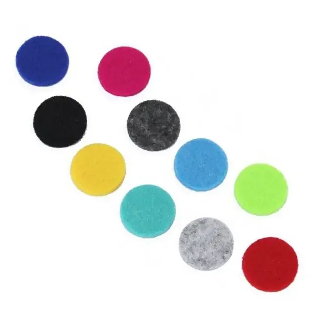 Pack of spare 10mm pads for aromatherapy jewellery, showing multiple small round white pads arranged neatly