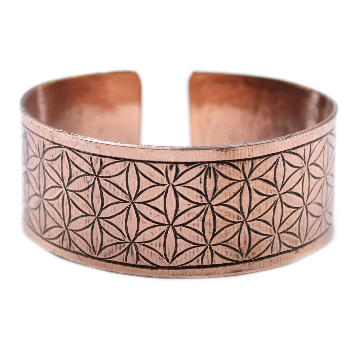 Copper spiritual bracelet featuring a Tibetan design with Flower of Life pattern in polished copper finish on wrist