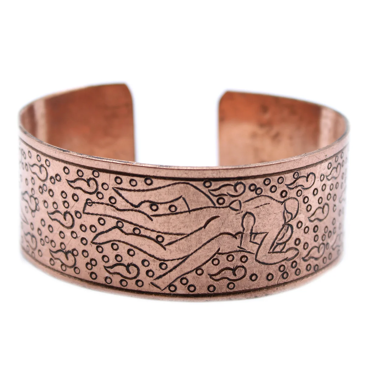 Close-up of Kamasutra copper bracelet featuring intricate Tibetan design and polished finish on a neutral background