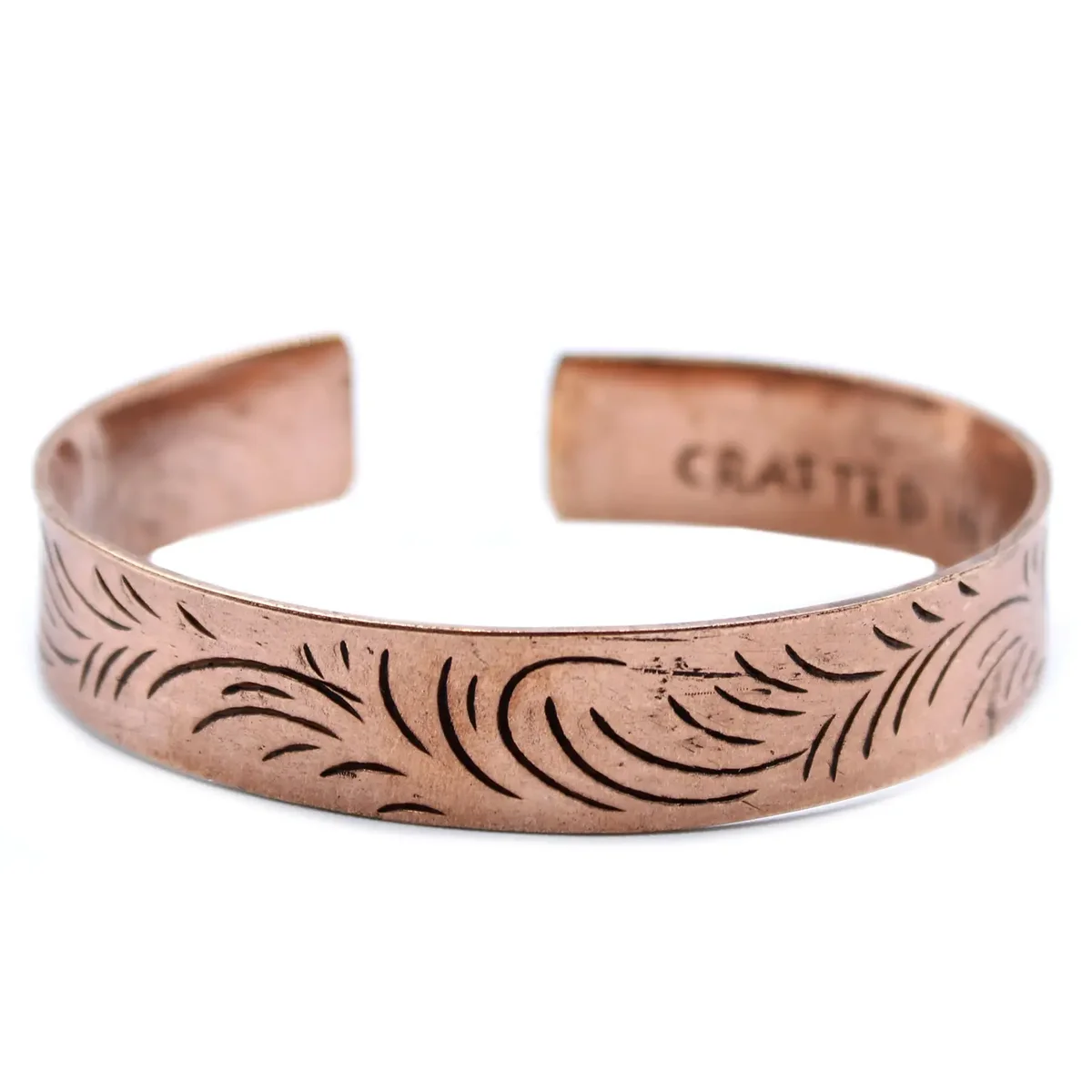 Copper wide tribal bracelet featuring intricate Tibetan swirls design in a polished finish