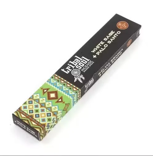 Bundle of natural incense sticks labeled Tribal Soul with White Sage and Palo Santo scent on a plain background