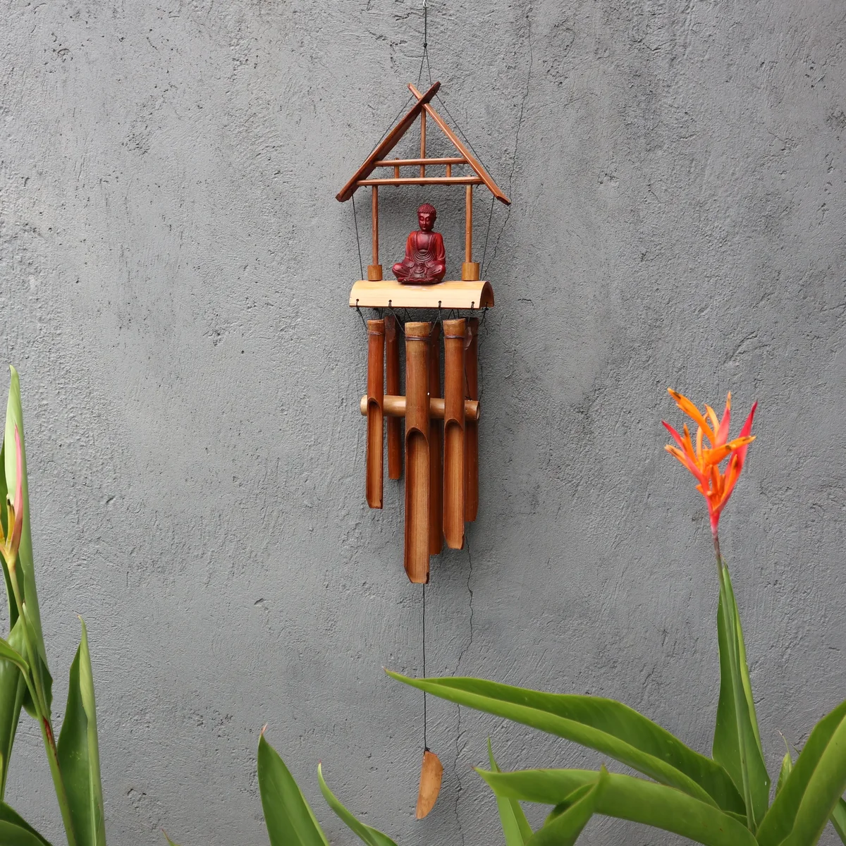 Brown Buddha natural finish windchime with 6 bamboo tubes hanging vertically on a wooden frame