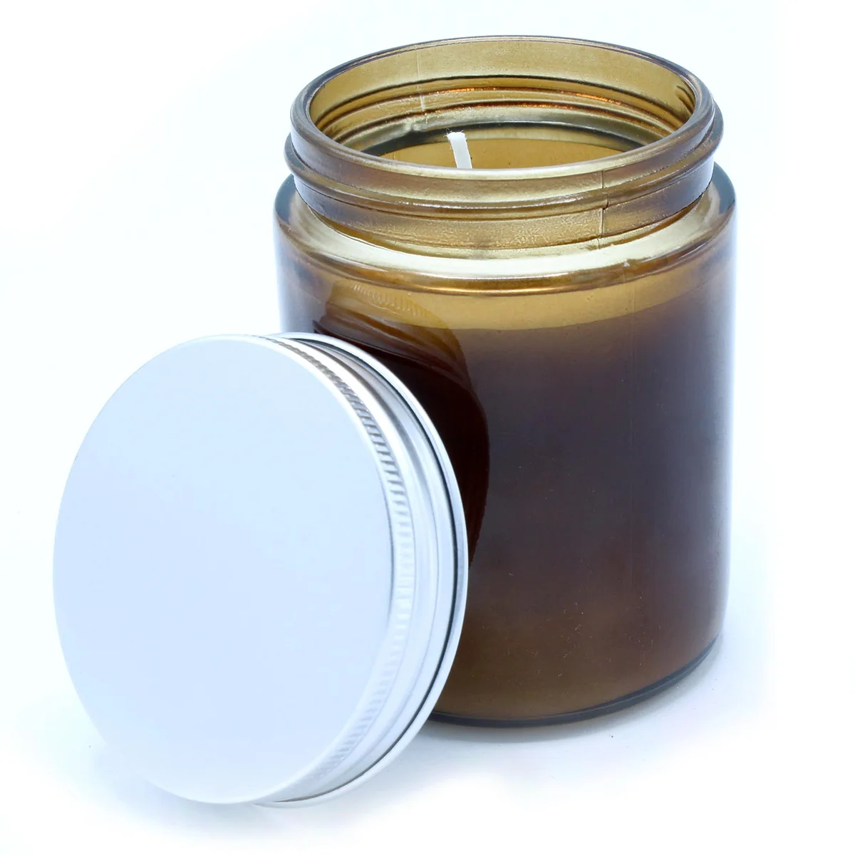 Unlabelled aromatherapy candle, creativity candle, a slender white wax stick.