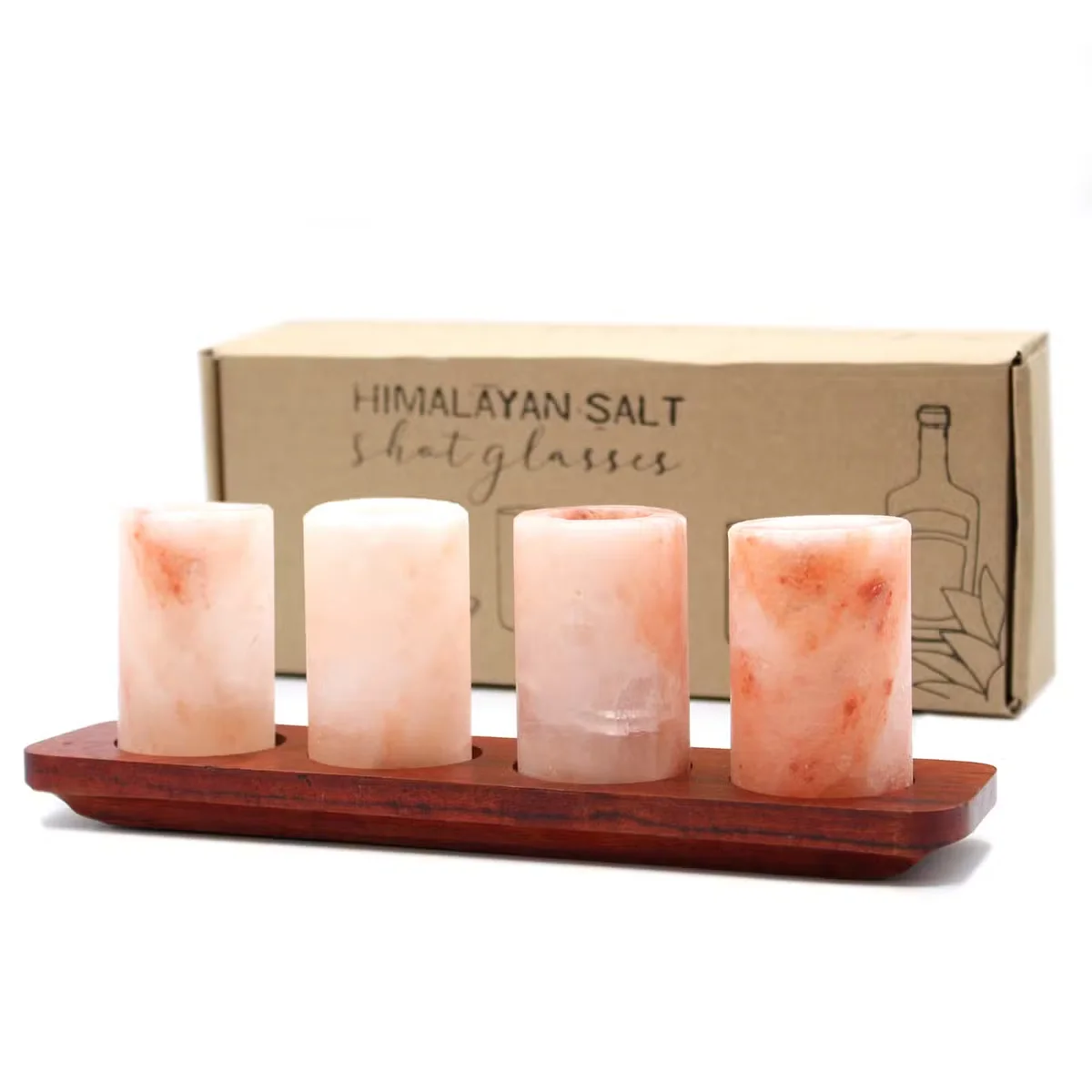 Four unique shot glasses made from Himalayan salt displayed on a wooden serving stand against a white background