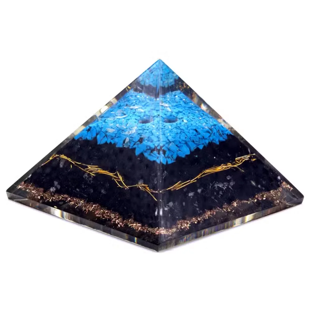 70 mm orgonite pyramid with turquoise and black tourmaline stones on a white background