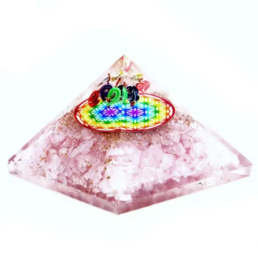 70 mm orgonite pyramid with rose quartz and rainbow Flower of Life design on clear resin background