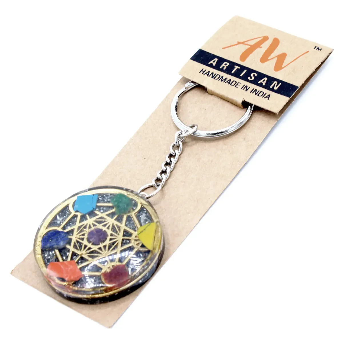 Round orgonite seven chakra keyring with colorful stones arranged in chakra order on a silver keyring loop