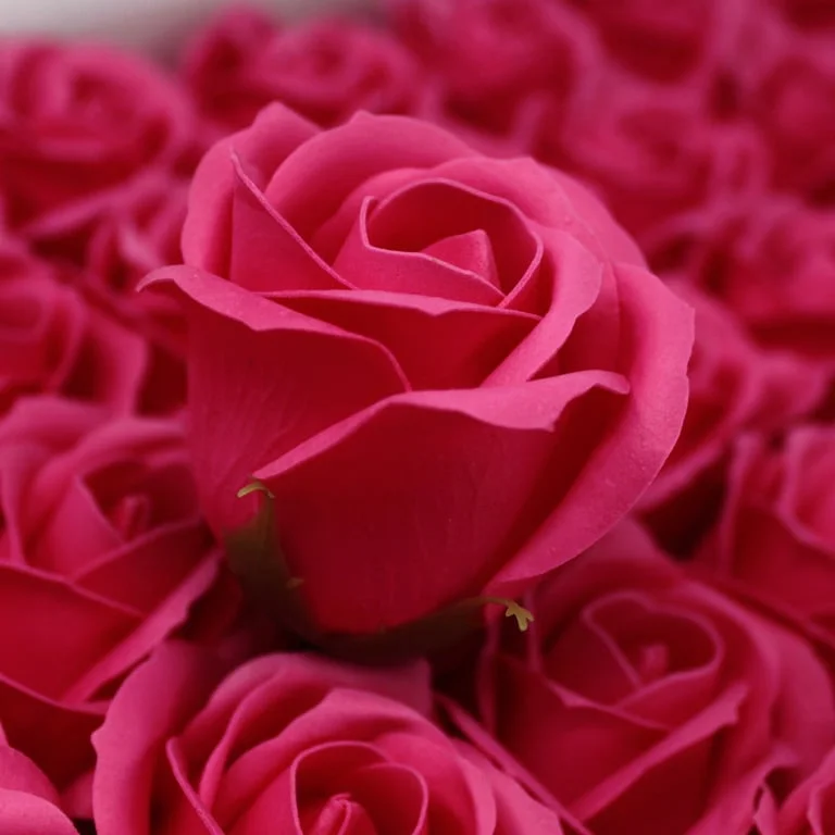 Hand‑crafted med rose soap shaped like a fresh rose in soft pink