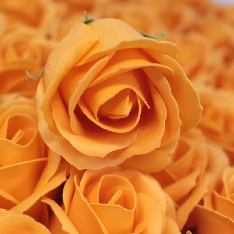 Orange soap rose crafted into a realistic mid-sized floral shape.