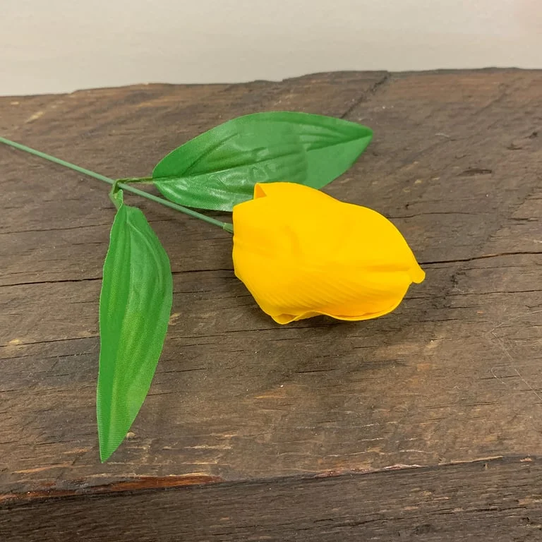 Yellow soap flower shaped like a medium tulip, with detailed petals.