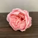 Craft soap flower shaped like a pink peony, large size, textured petals visible