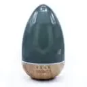 Compact USB diffuser with colour‑changing LED and built‑in timer, set against a neutral background.
