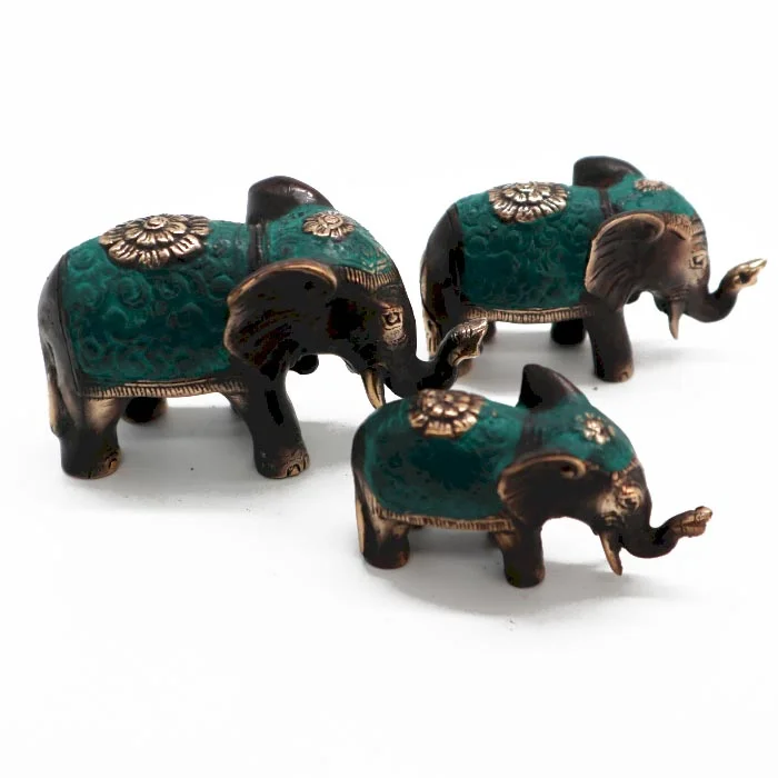 Set of three lucky elephant ornaments in assorted sizes arranged side by side on a plain background