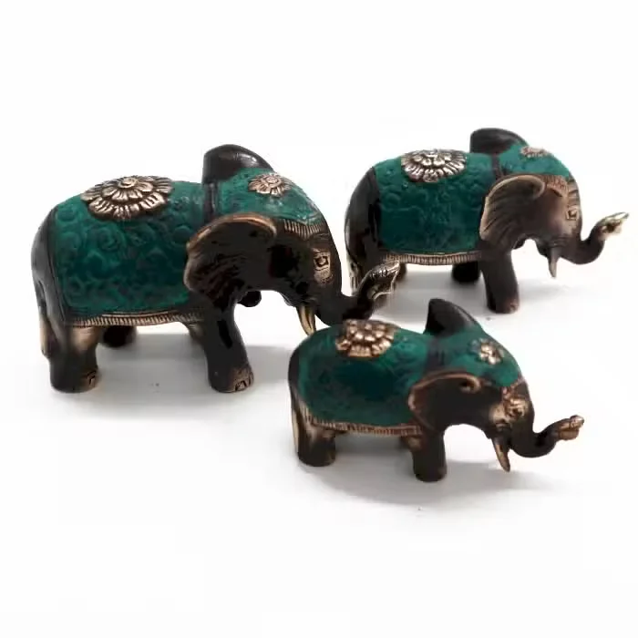 Set of three assorted size lucky elephant home decor figurines arranged together on a white background