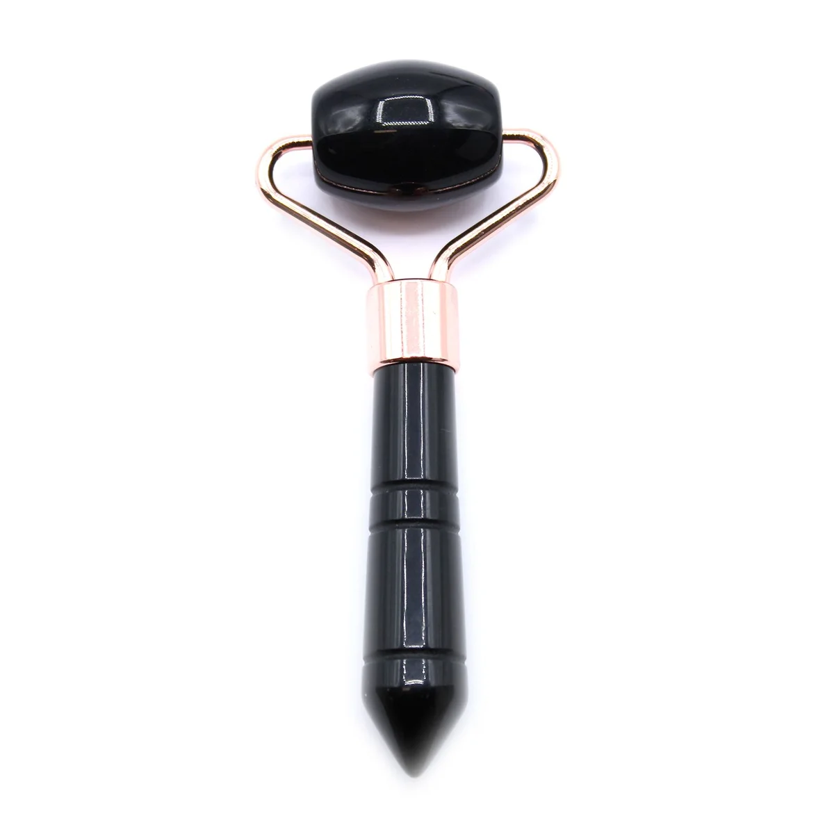 Black obsidian roller with smooth polished stone and wooden handle for facial massage and skincare rituals