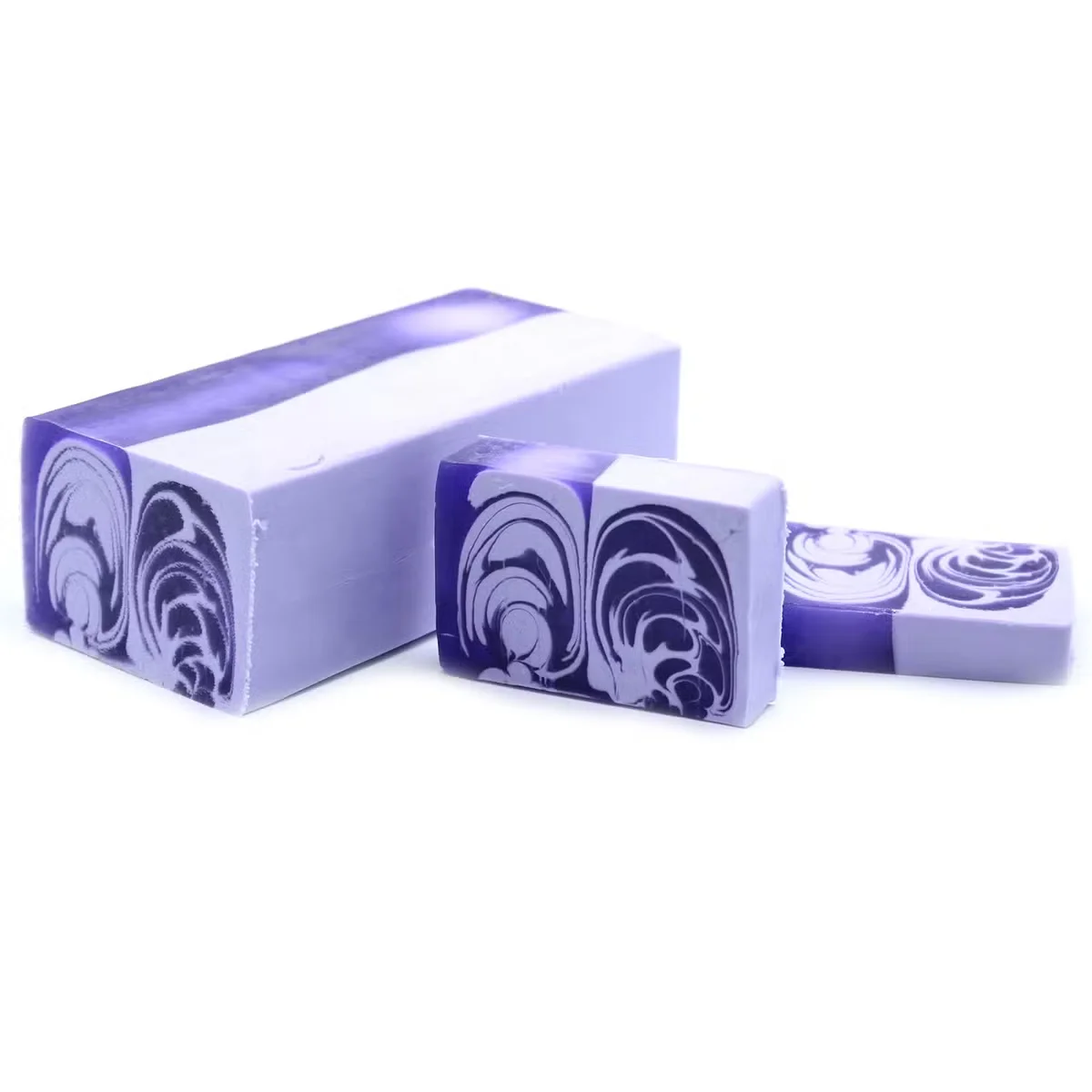Large handcrafted lilac soap loaf weighing 1.2kg with smooth, creamy texture on a white background
