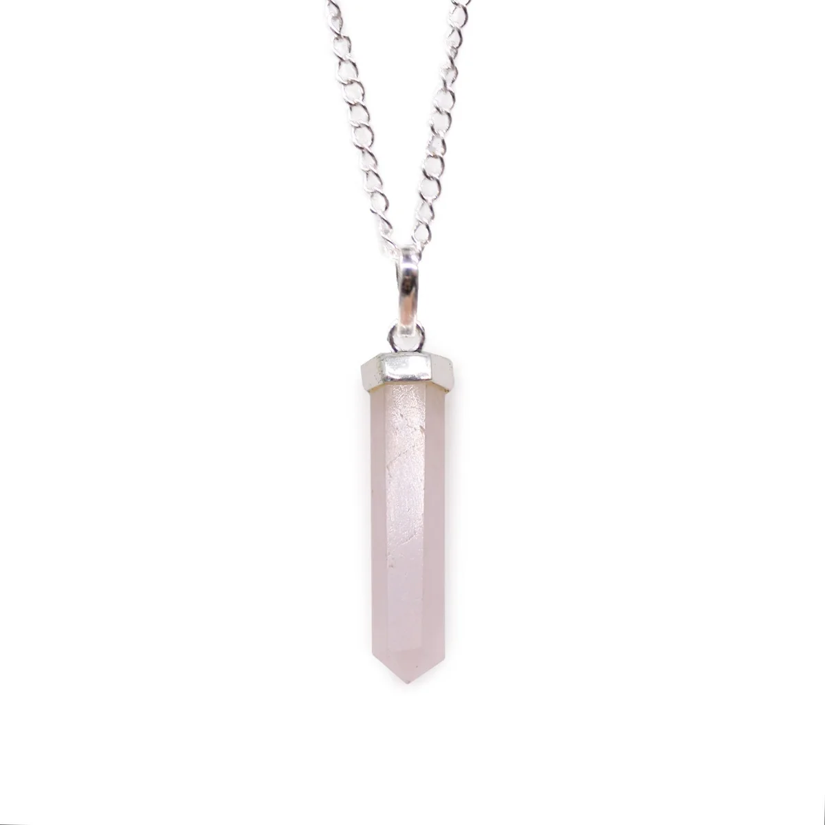 Rose quartz pendant with a classic pointed gemstone on a delicate silver chain against a white background