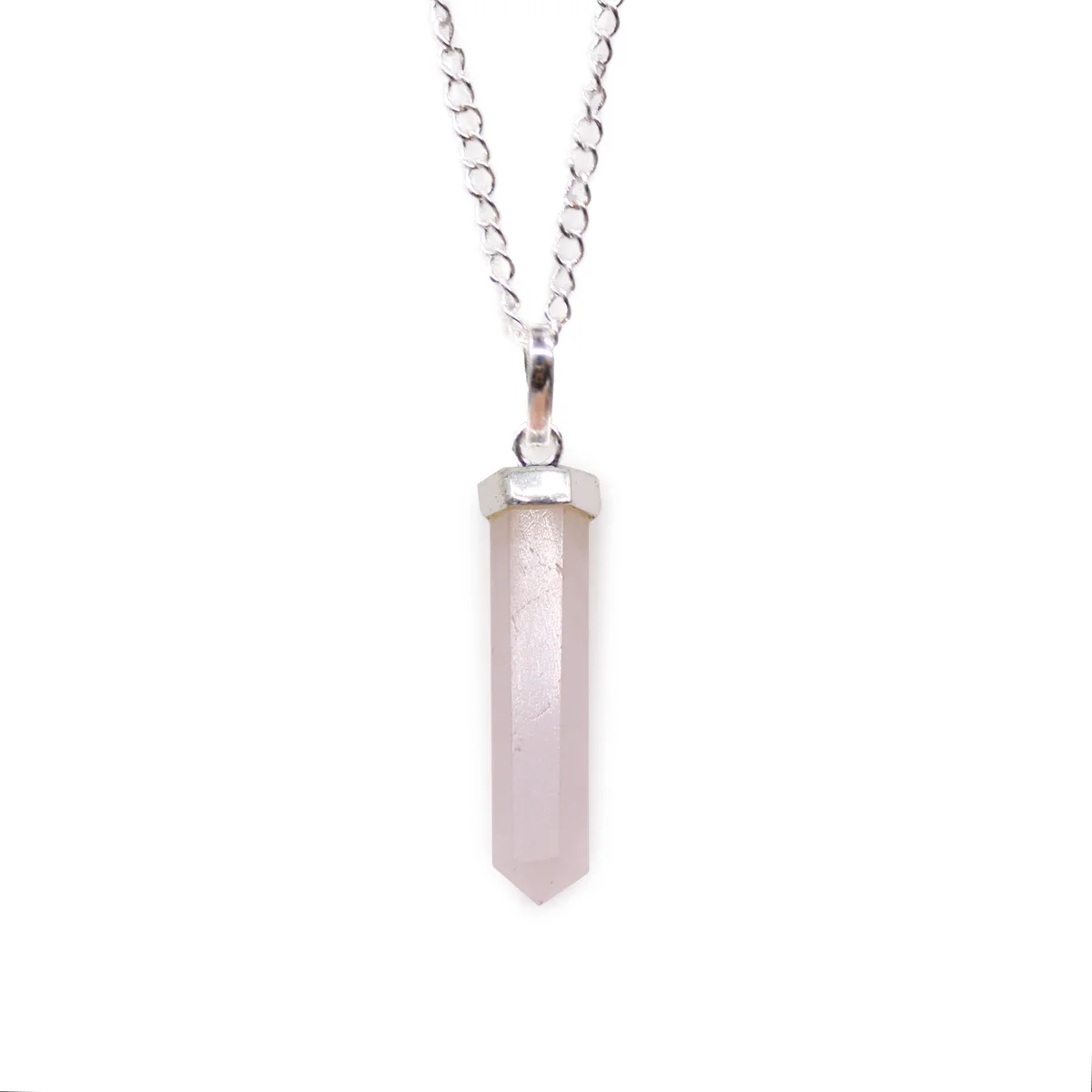 Rose quartz classic point pendant with silver chain on white background, showcasing the gemstone's soft pink hue