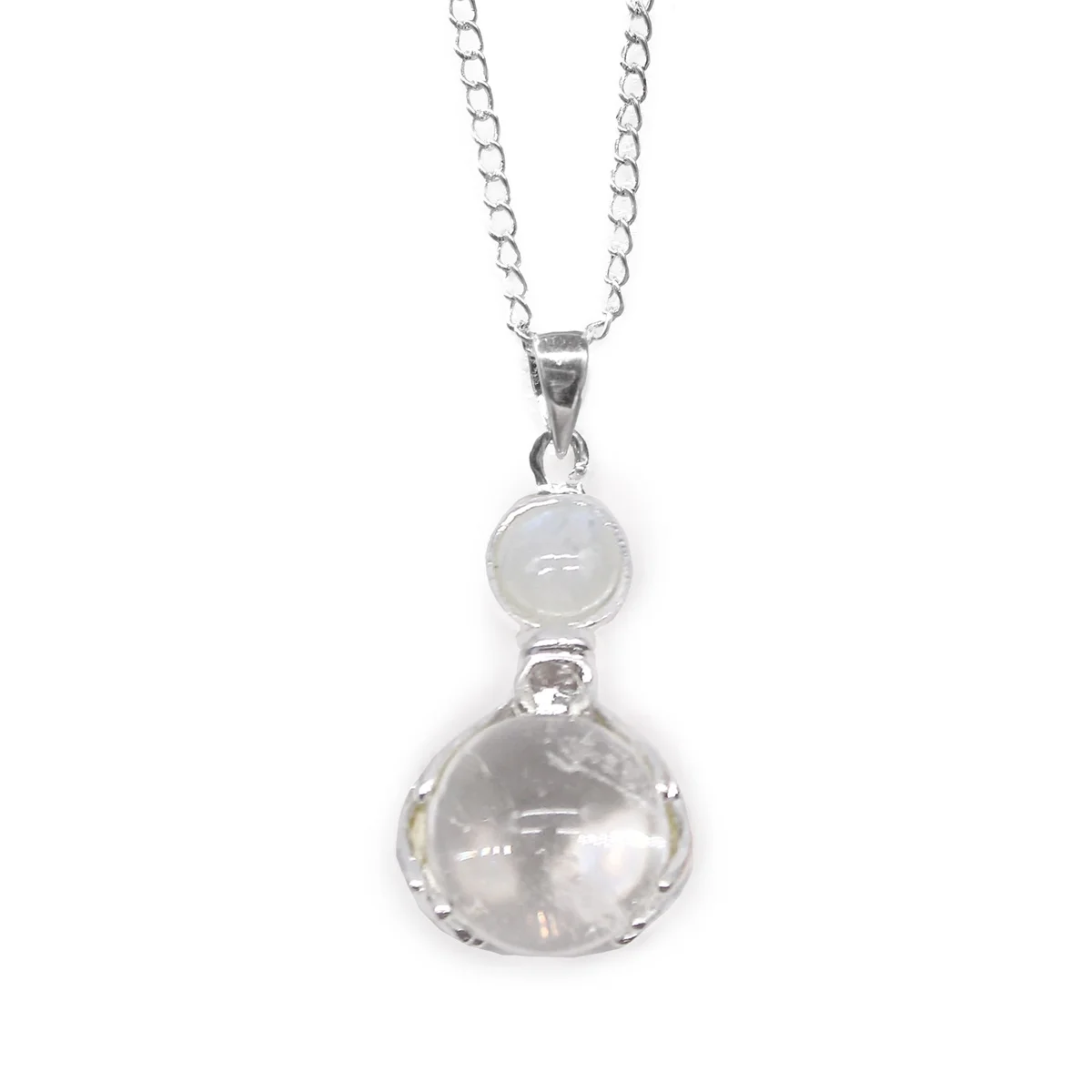 Rock quartz pendant featuring gemstone healing hands design on a silver chain against a white background
