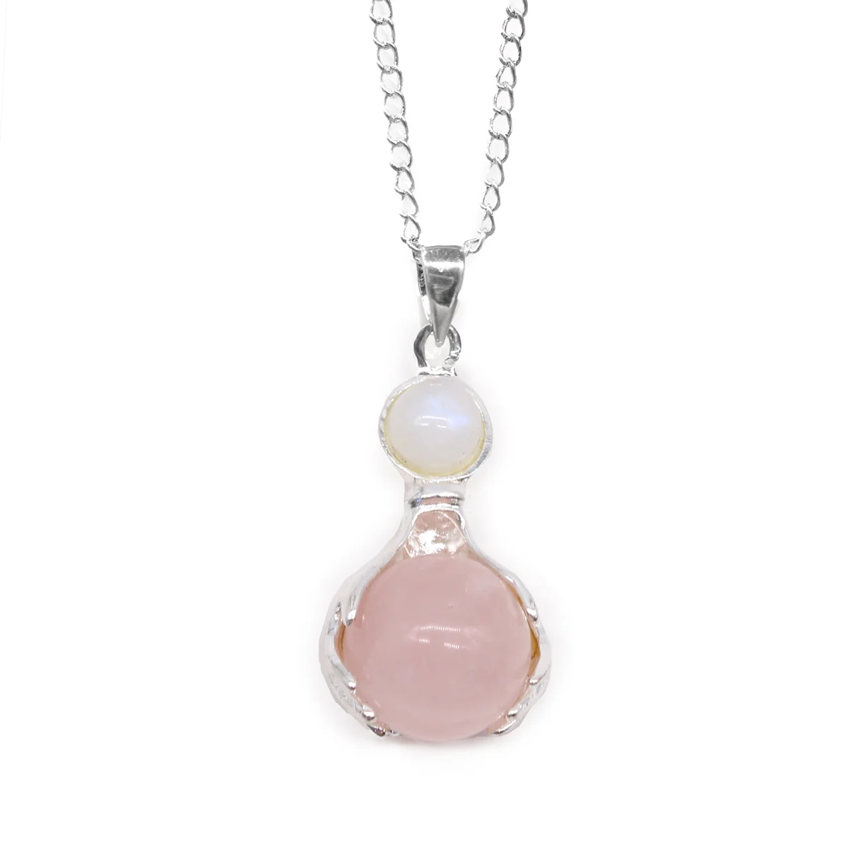 Rose quartz healing hands necklace pendant with polished pink gemstone on a silver chain against white background