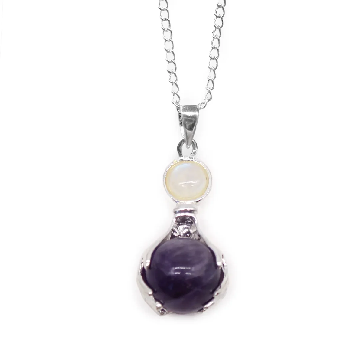 Silver pendant shaped like hands holding a purple amethyst gemstone healing pendant on a white background