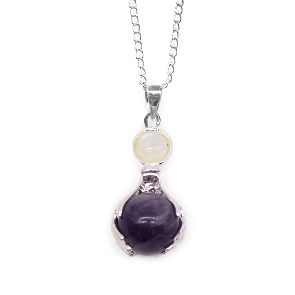 Close-up of amethyst healing hands pendant showcasing purple gemstone, ideal amethyst jewellery UK accessory