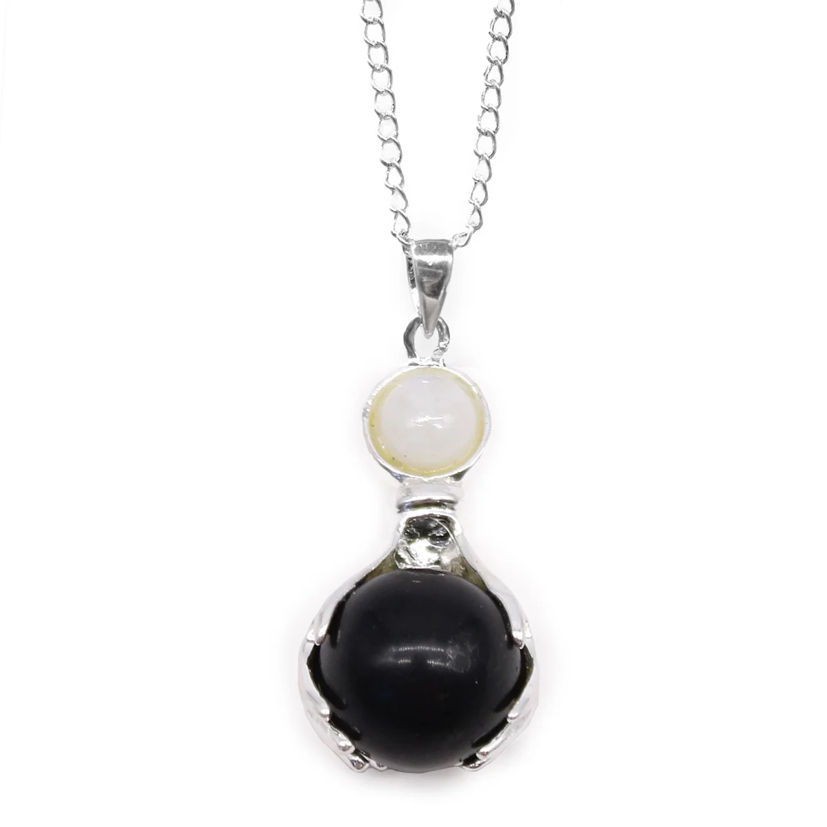 Black agate pendant featuring gemstone healing hands design on a silver chain necklace against white background