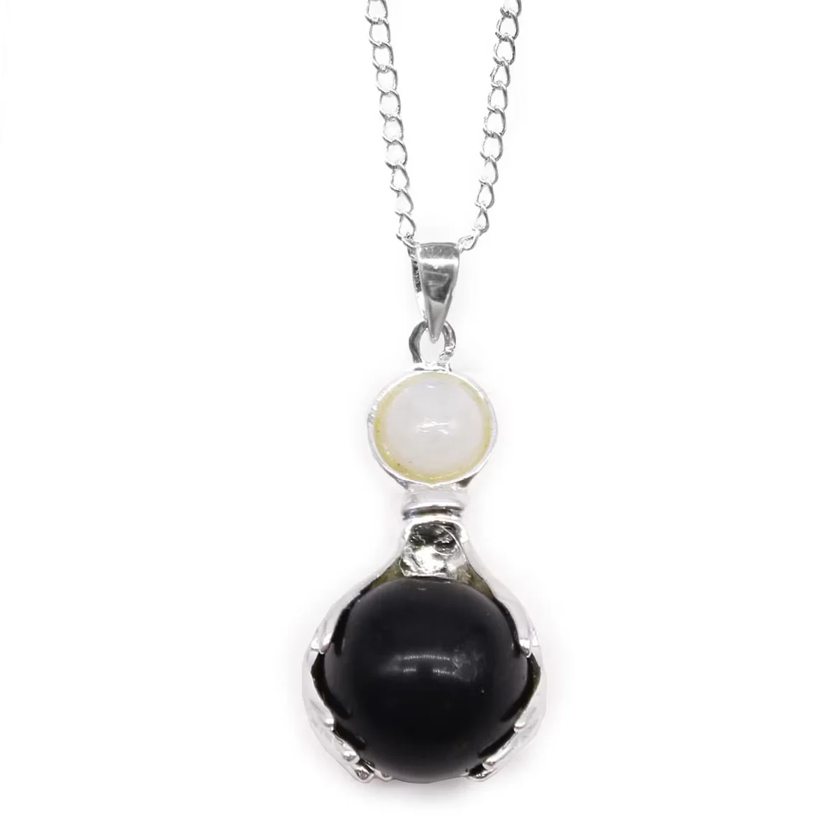 Gemstone Healing Hands Pendant featuring polished black agate stone on a silver chain, black agate jewellery style