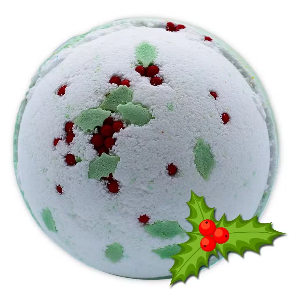 Round holly berry bath bomb with festive red and green colors and mistletoe decoration on a white background