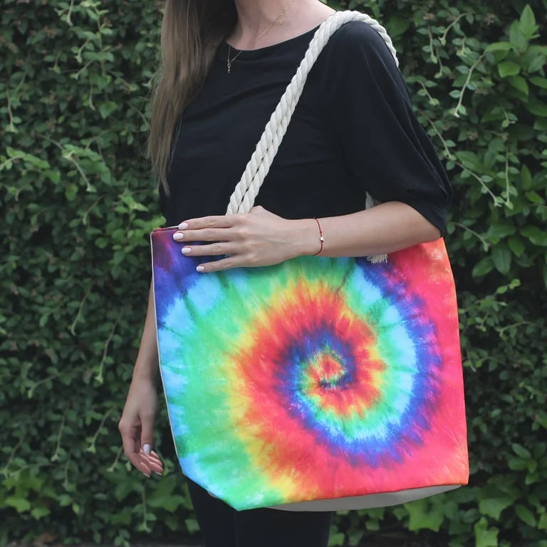 Colourful fashion bag featuring a psychedelic splash pattern with nature inspired colours.