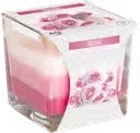 Rainbow jar candle in rose scent, clear glass with colourful wax ring, melted wax inside, home fragrance candle