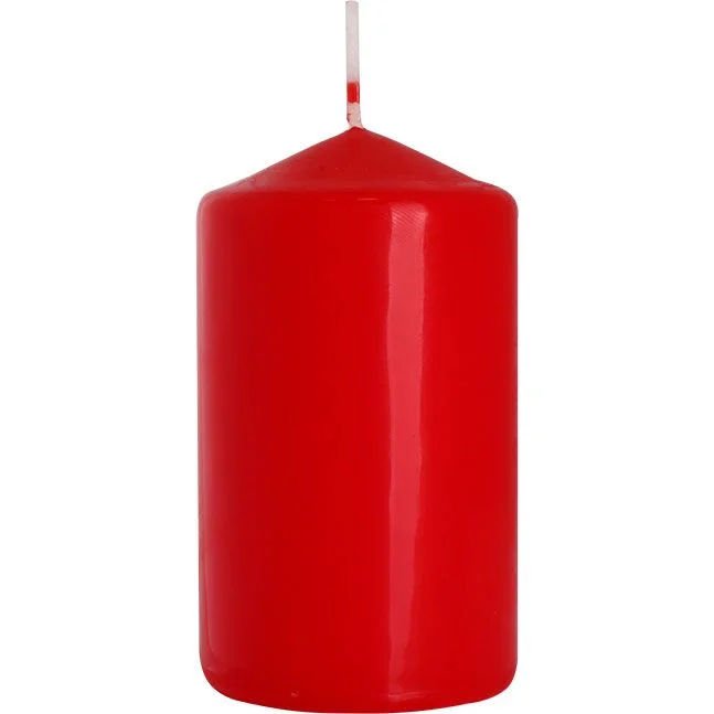 Red pillar candle measuring 60x100mm with smooth surface and unlit wick on top
