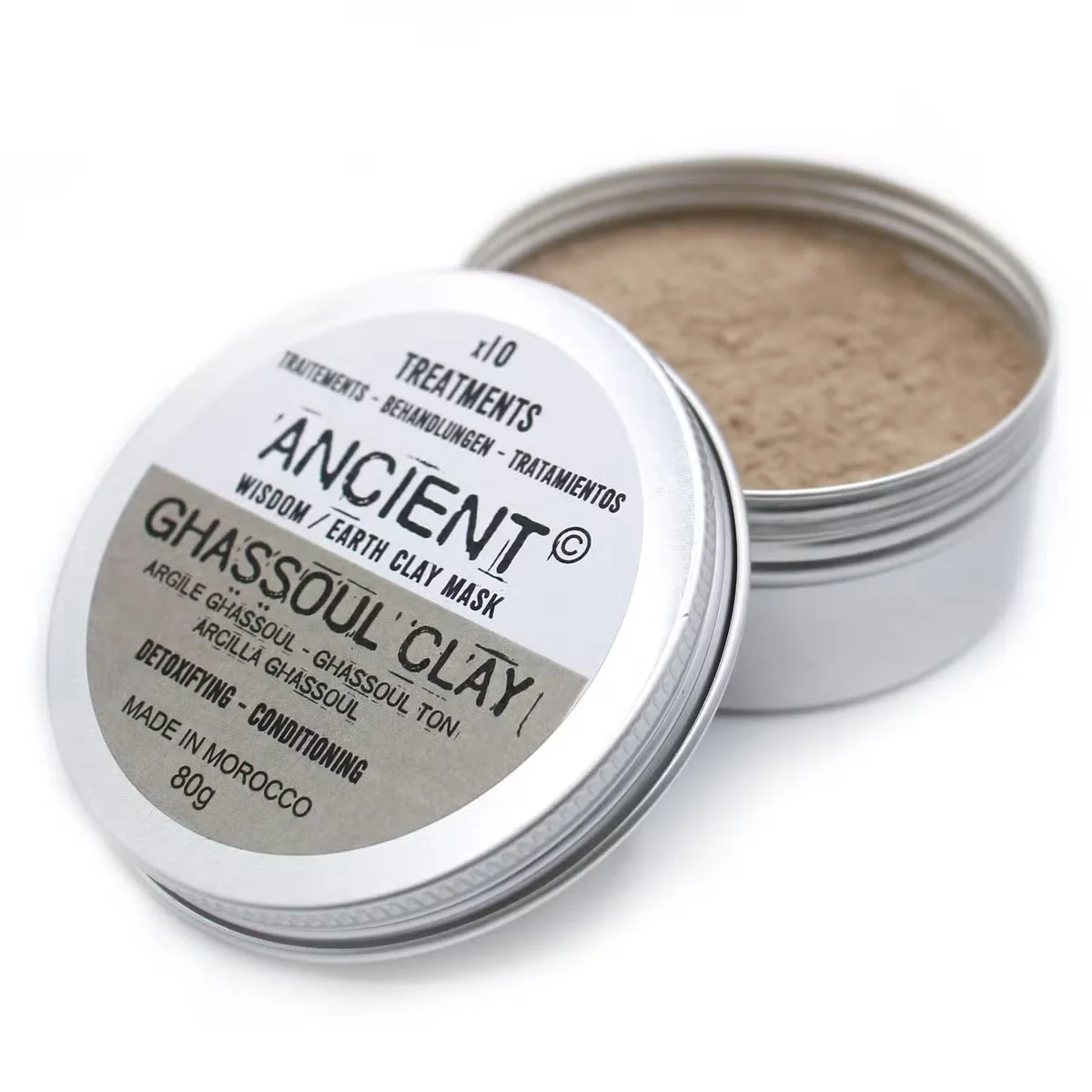 Small jar of ghassoul clay 80g with natural clay powder visible inside on a white background