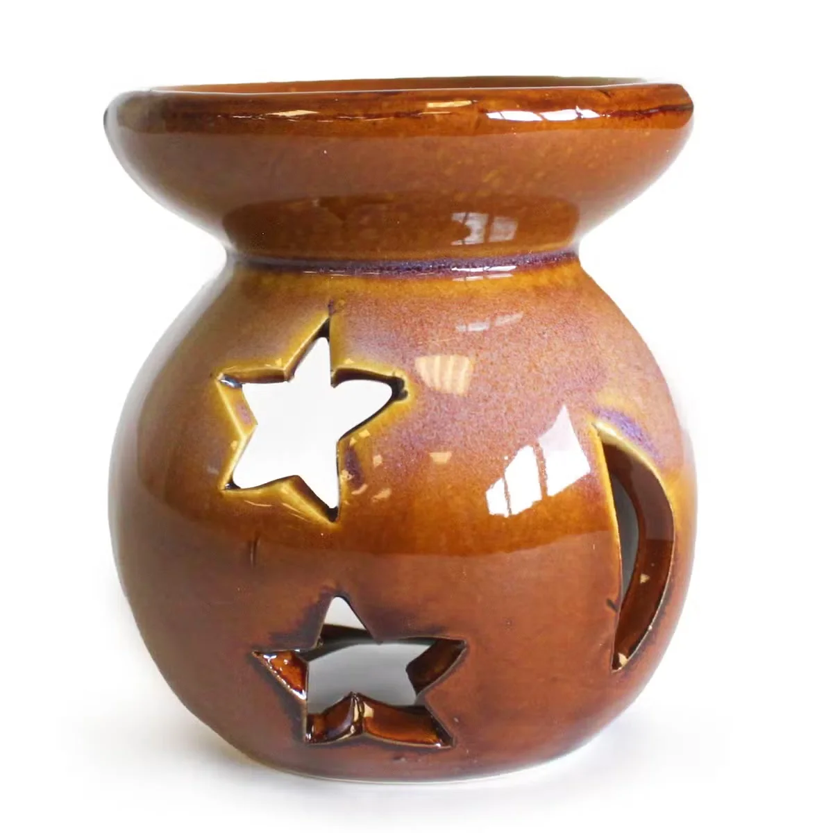 Moon & Star Oil Burner with moon and star decor, designed for holding and warming scented oils