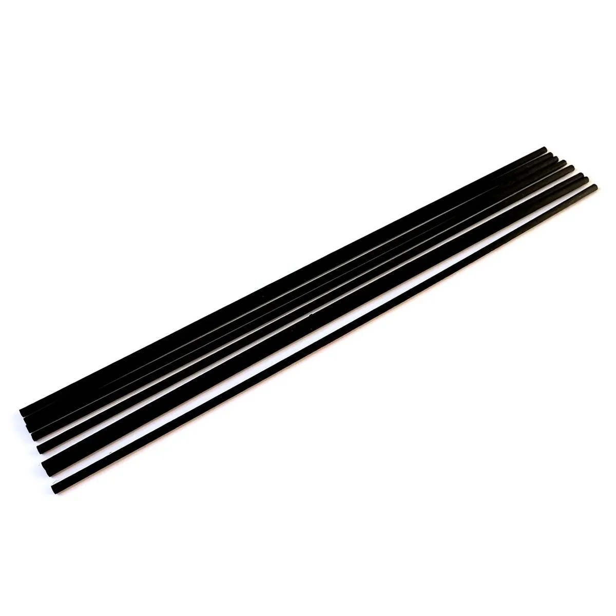 Black fibre reed diffuser with 25cm long, 3mm thick reeds in a minimalist container, reed diffuser 25cm length visible