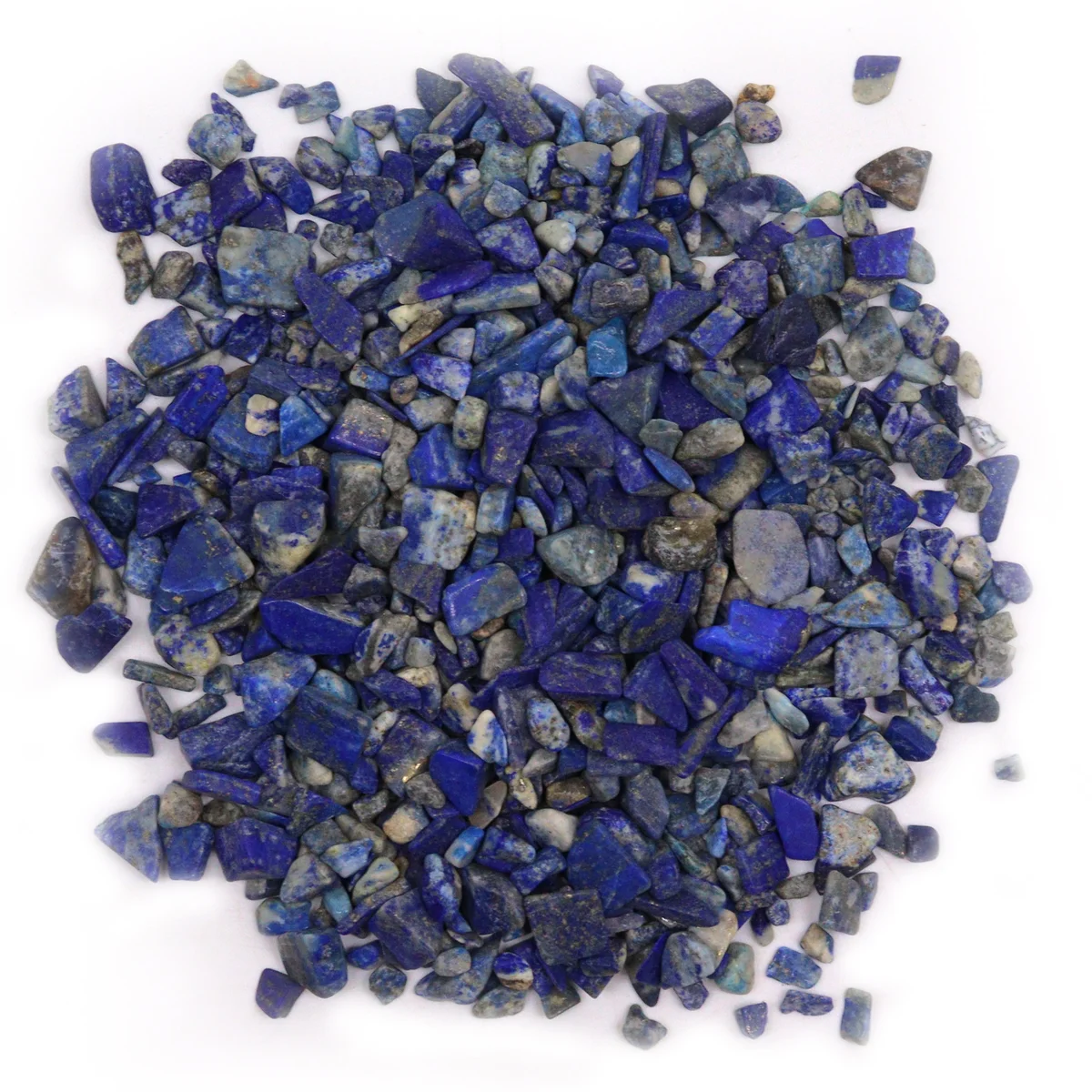 Close-up of deep blue lapis chips 1kg showing irregular shapes and natural texture in bulk pile