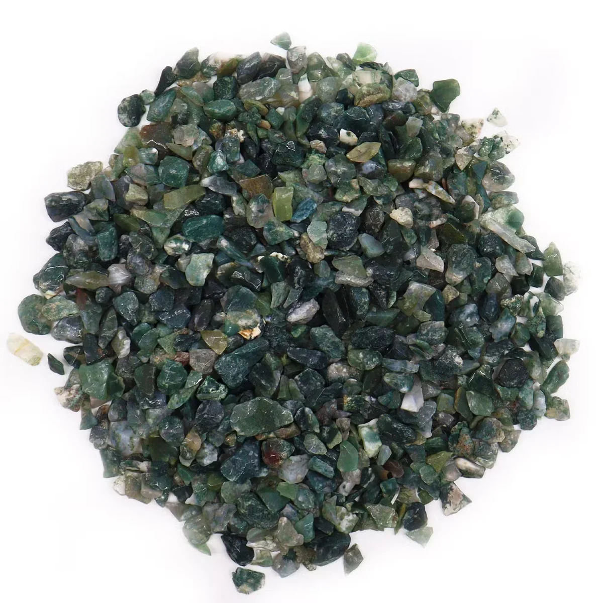 Close-up of green and white moss agate 1kg gemstone chips in bulk pile on white background