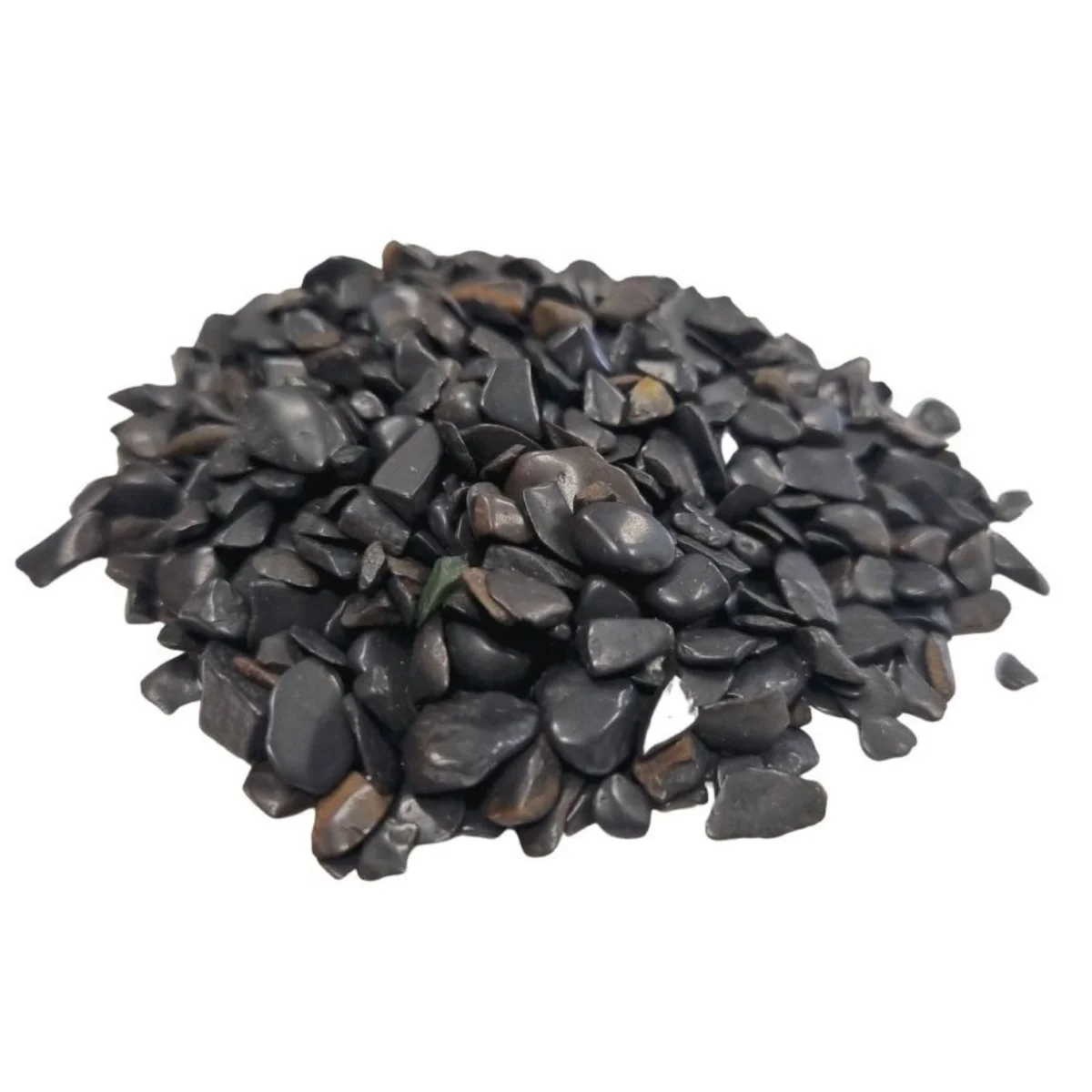Pile of black tourmaline chips gemstones weighing 1 kilogram on a white background