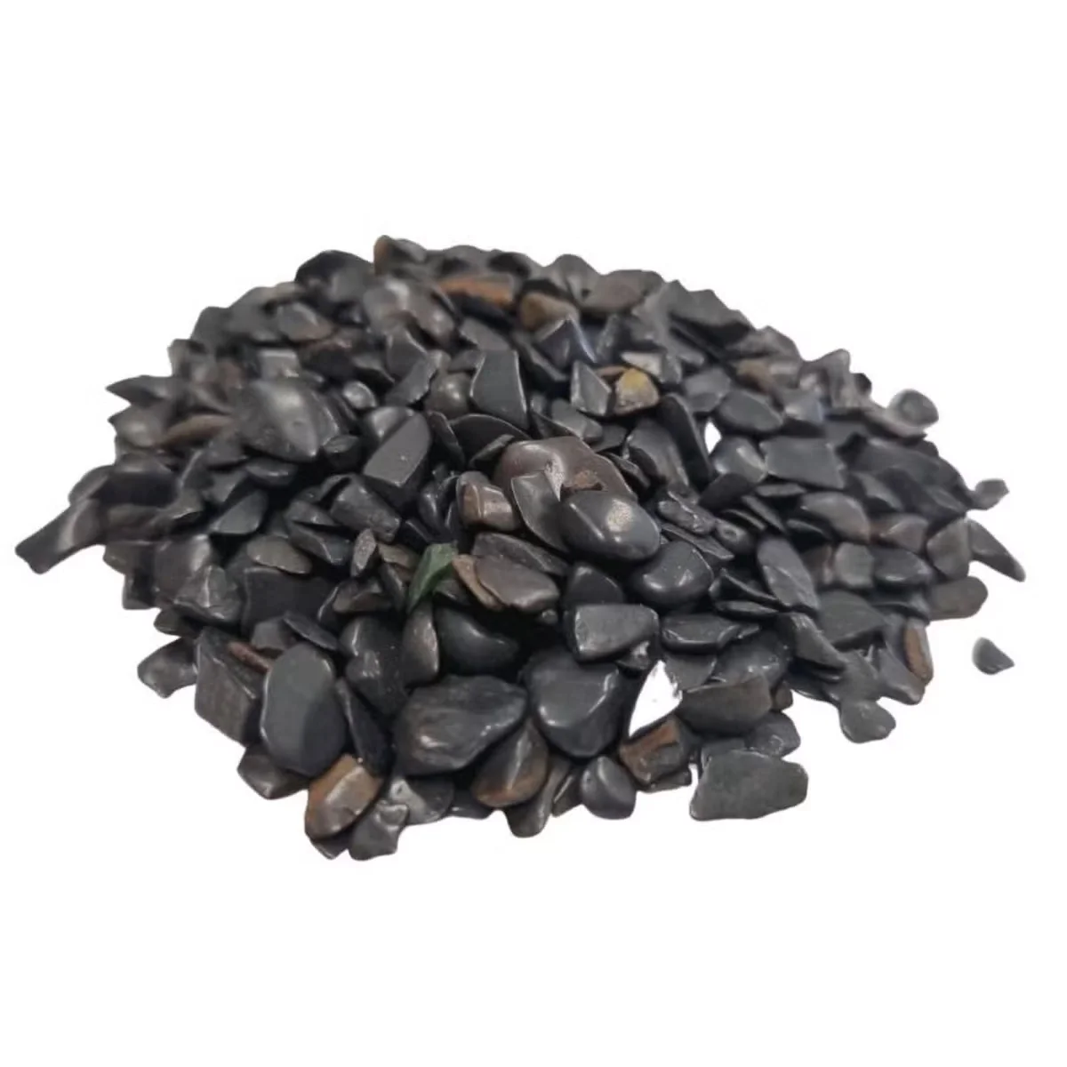 Close-up of black tourmaline 1kg gemstone chips showing rough, irregular shapes and textures