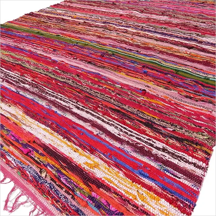 Luxury red rag rug measuring 150 by 90 cm with a textured woven pattern on a white background