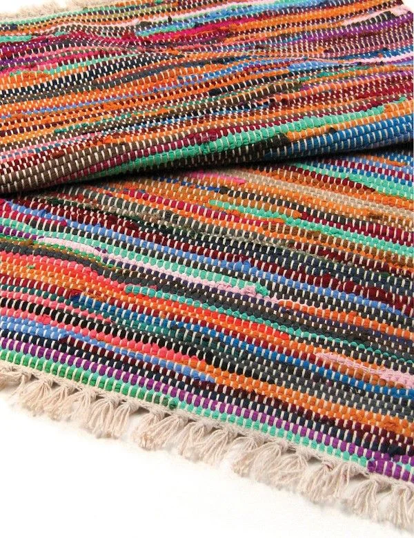 Luxury rag rug in natural tones measuring 155 by 90cm laid flat showing texture and pattern