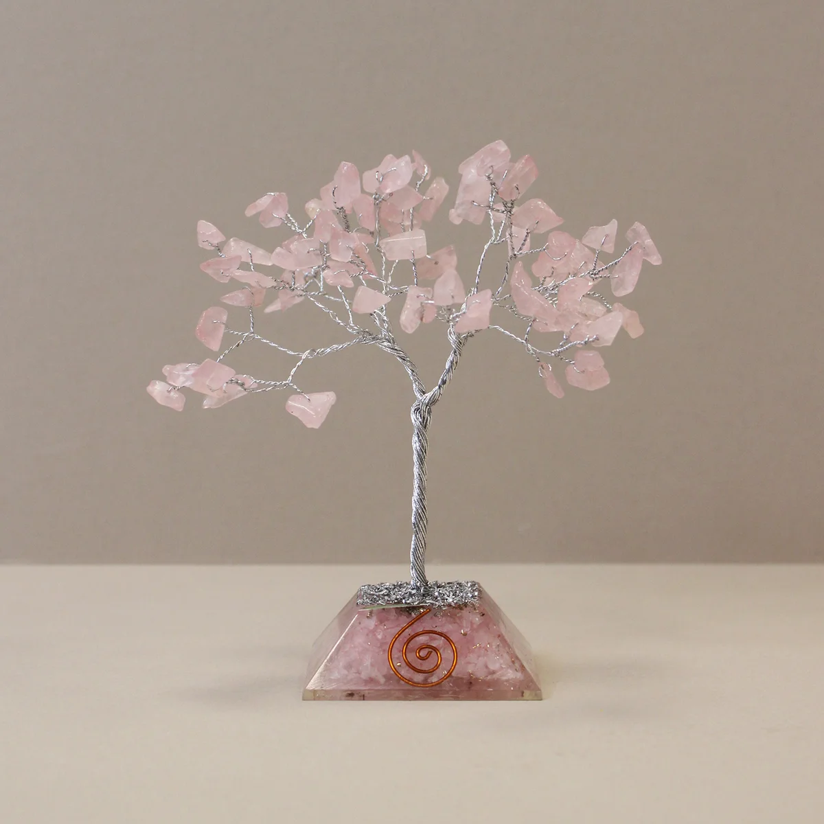 Gemstone tree with 80 rose quartz stones on a decorative organite base decor piece