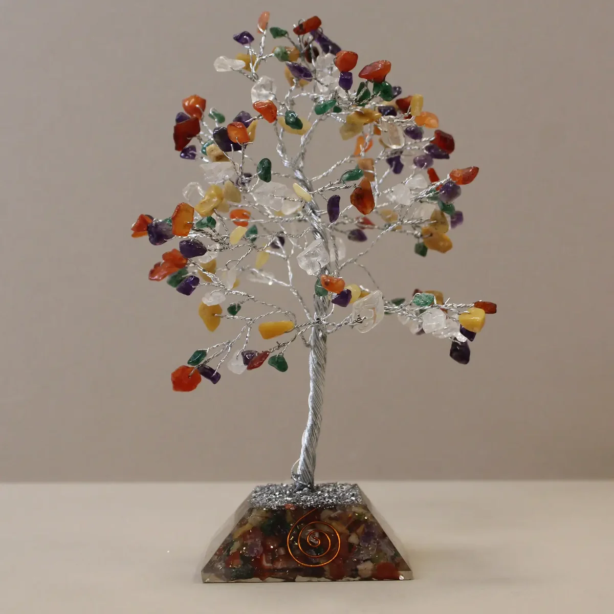 Multi-colored gemstone tree with 160 stones on a decorative organite base decoration for home display